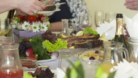 festive dinner table with grilled salmon steaks served on decorative platter