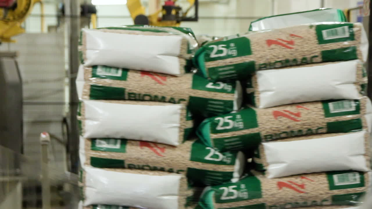 Pile Of Bags Of Coniferous Pellets. Pile of sacks of pellets, which are stacked on pallets