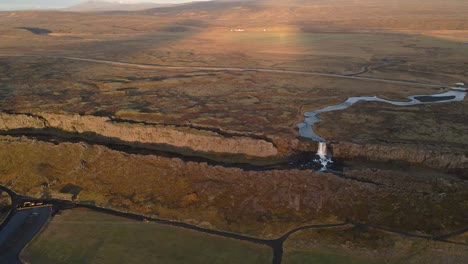 drone flying over thingvellir national park with oxararfoss waterfall, iceland