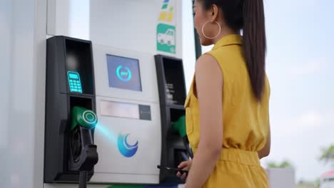 a person actively refueling their vehicle at a modern gas station, interacting with a digital pump interface, showcasing convenience and technology in fueling.