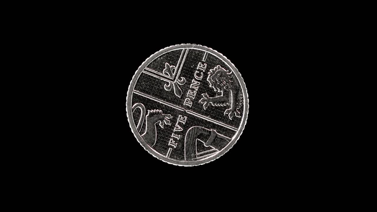 United Kingdom 5 pence 2012 reverse showing Royal Shield segment, macro loop on black background