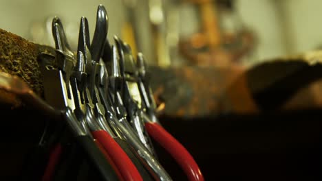 Pliers-arranged-in-workshop-4k