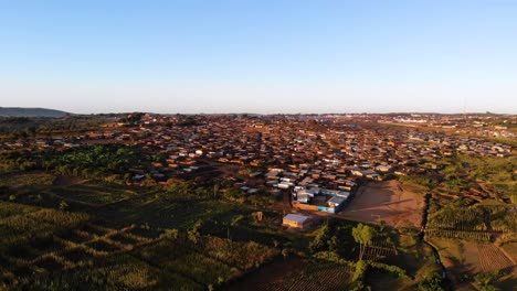 settlement in central africa, aerial approaching view