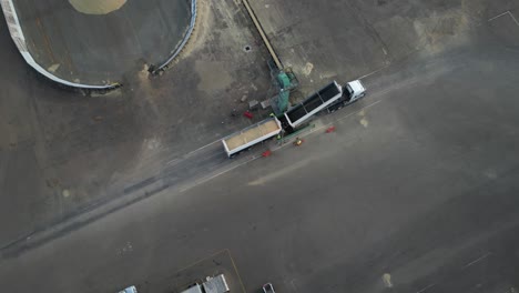 Cargo-truck-unloading-grain-in-empty-grid