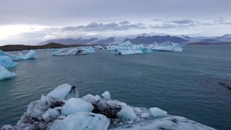 aerial of volcanic icebergs in jökulsárlón glacier lake of iceland