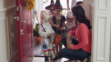 children in halloween costumes trick or treating shot on r3d