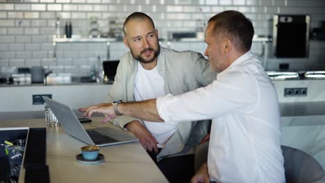 two motivated businessmen are discussing a project during lunch. take a break from work. modern world providence