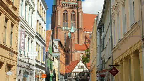 aug 2020, schwerin, germany: view of schwerin lutheran cathedral from a narrow alley of the old town