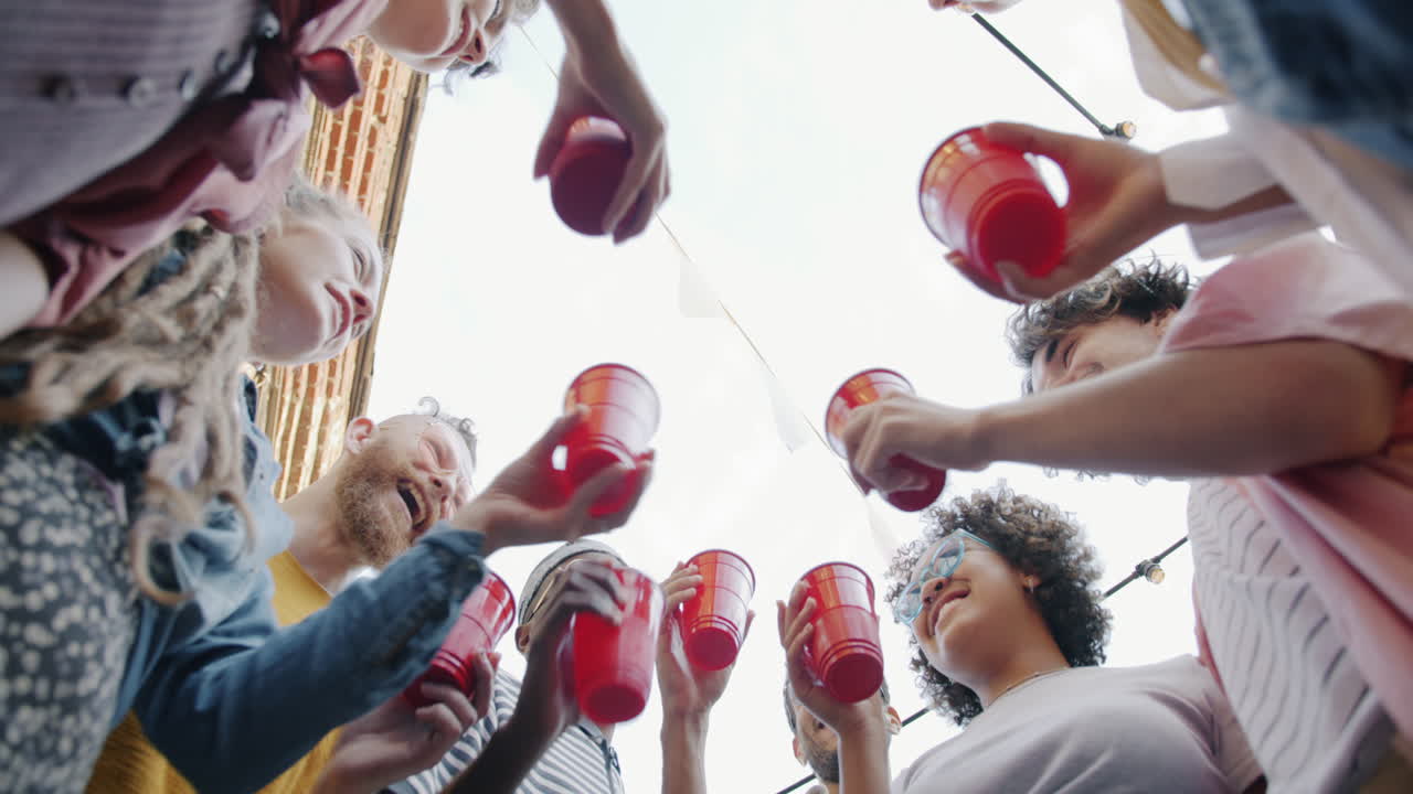 Friends Toasting with Red Cups