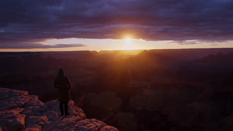 person admiring grand canyon sunset