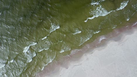 Foamy-Waves-Rolling-Gently-On-The-White-Sand-Shore-Of-The-Baltic-Sea