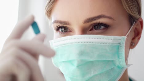 Handheld-view-of-female-doctor-holding-medicine