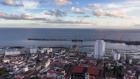 sunset aerial view over ponta delgada commercial port, são miguel