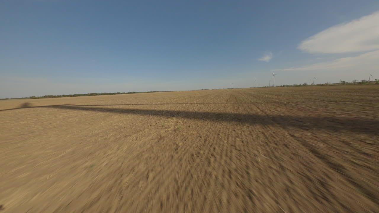 Empty Farmland with Wind Turbines