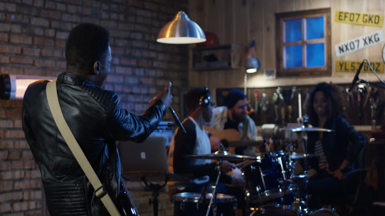 Band Rehearsing in a Recording Studio