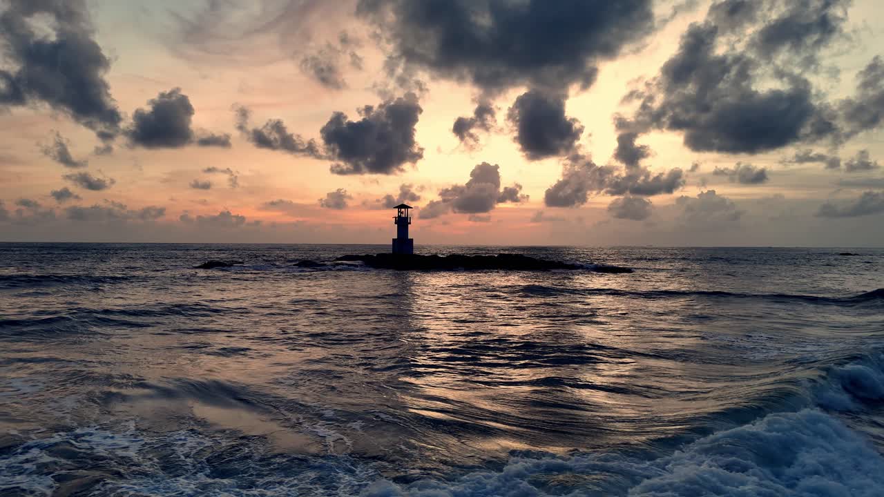 Lighthouse at Sunset on a Calm Sea
