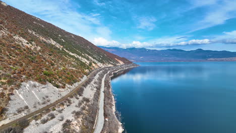 Flying-over-a-calm-lake-and-the-mountain-next-to-it