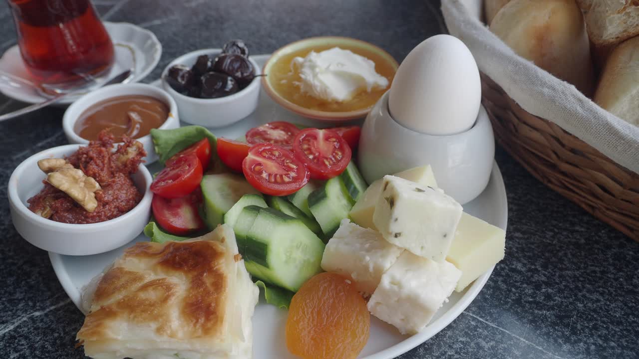 A close-up of a traditional Turkish breakfast spread with various dishes