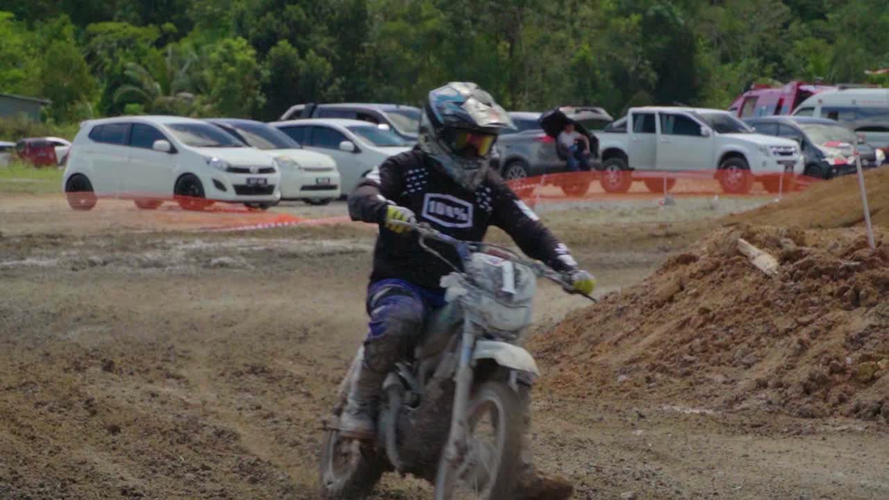 Motocross Rider on a Dirt Bike Track