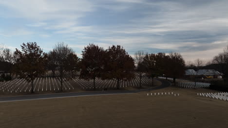 Aerial-flying-above-vast-cemetery-with-many-headstones-in-Fayetteville,-Arkansas