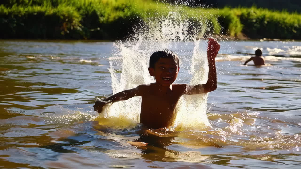 Young Boy Playing and Splashing in a River