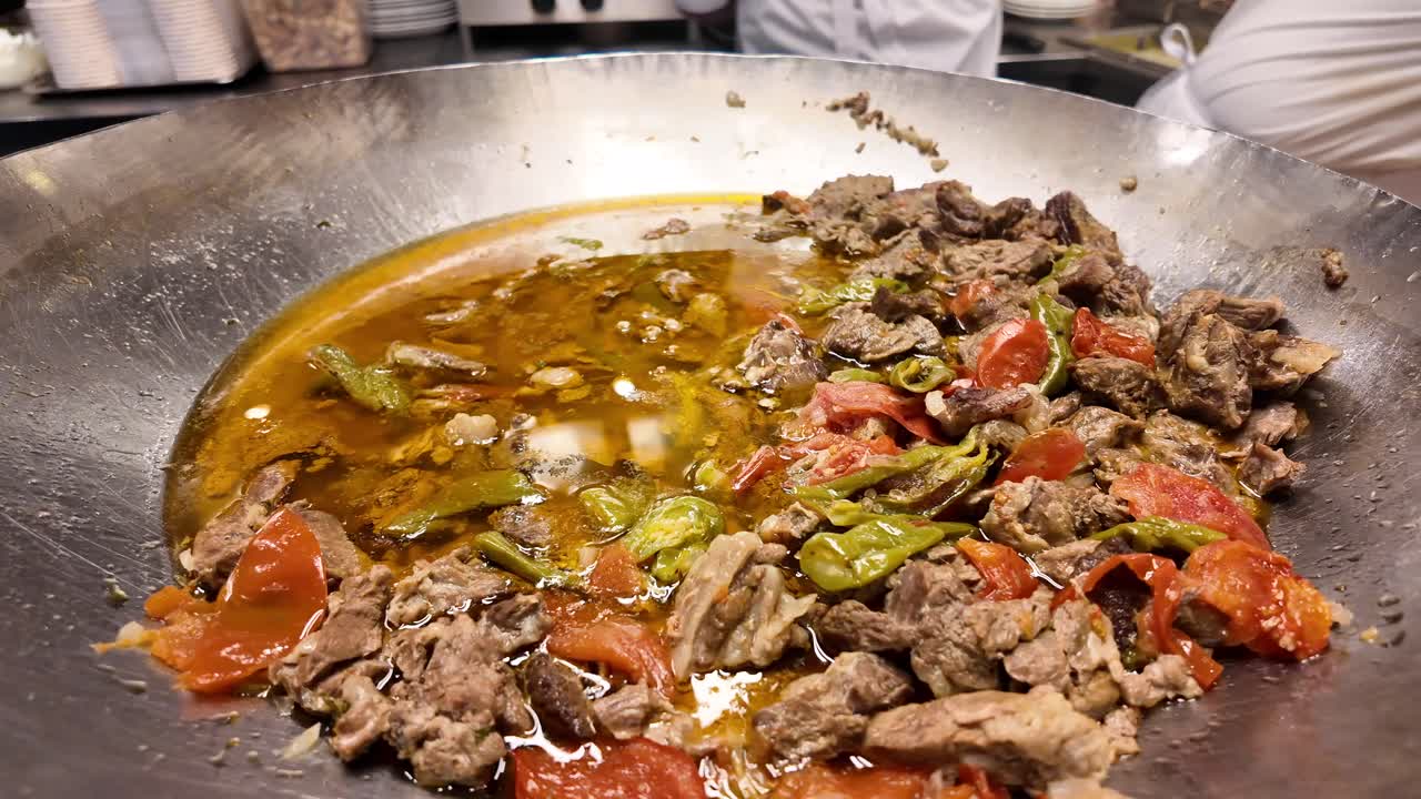 Large pan of stewed meat and vegetables
