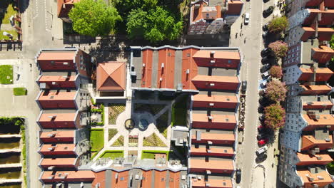 red-tiled roofs of old town buildings block in gdansk - aerial top-down view from drone