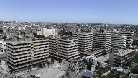 aleppo under the sunlight in aerial view with a drone. we can see the ruins of the syrian city all over the horizon 4k