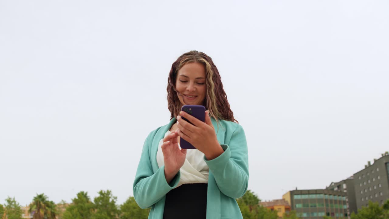 Woman using smartphone outdoors