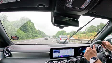 car journey with active windscreen wipers