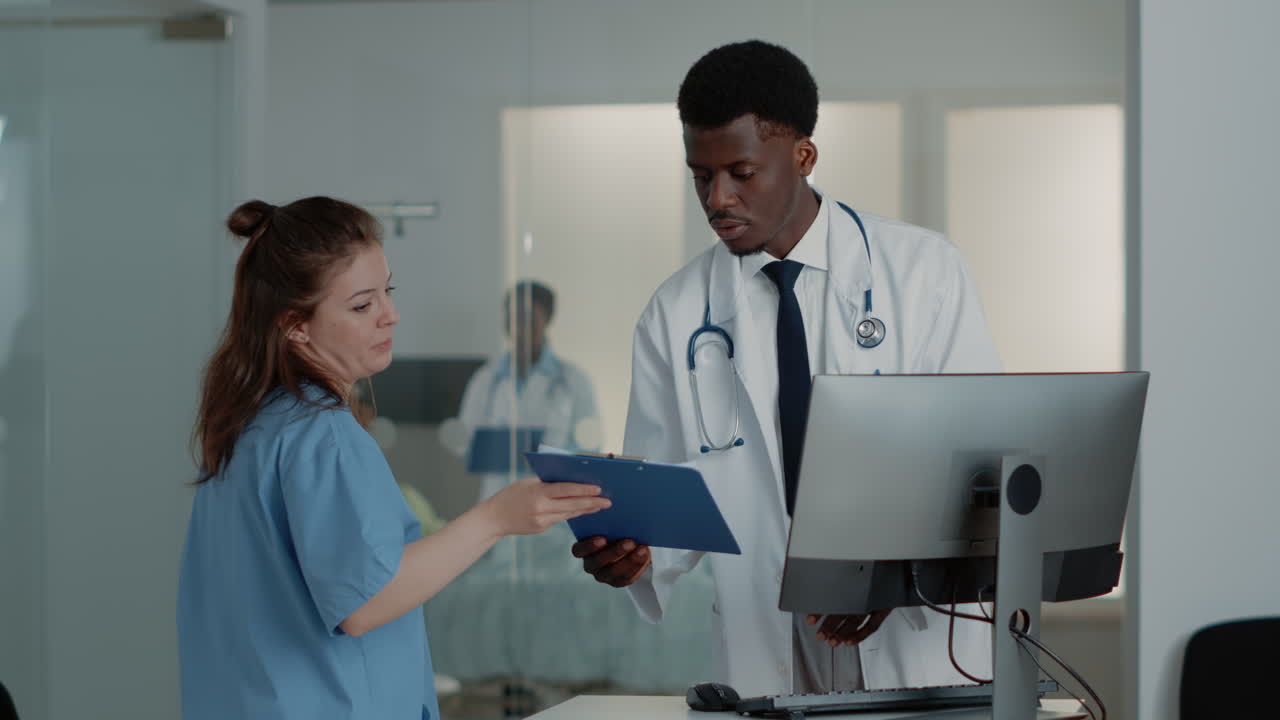 Man working as doctor using computer and documents