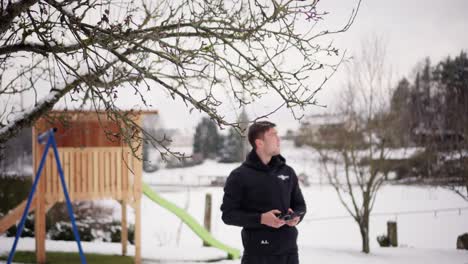 Young-man-using-a-drone-remote-control