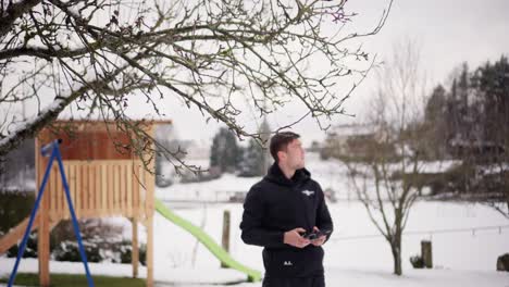 young man using a drone remote control