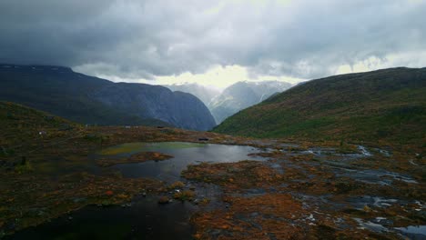 drone flies over the high plateaus of norway with a view of lake troll after severe storms