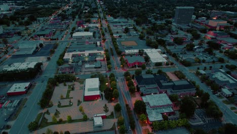 Aerial-of-Columbus,-Georgia-at-dusk:-city-grid,-illuminated-streets