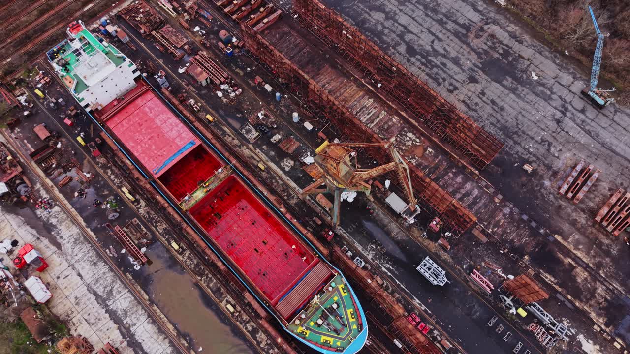 Ship docked at shipyard for cargo loading and unloading tasks
