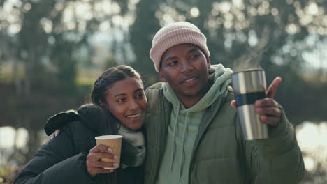 Camping,-coffee-and-couple-hug-in-conversation