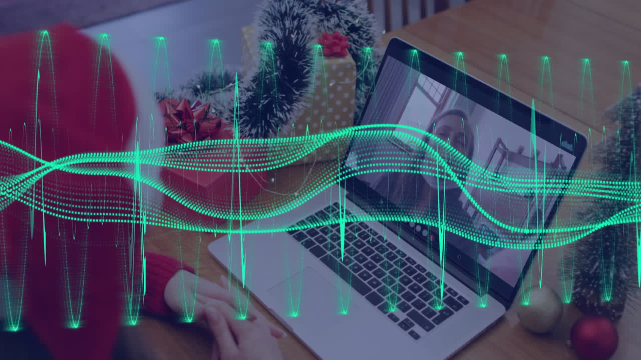 Virtual meeting on laptop with festive decorations and digital sound waves animation
