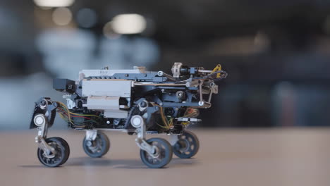a sophisticated multi-wheeled robot on a table