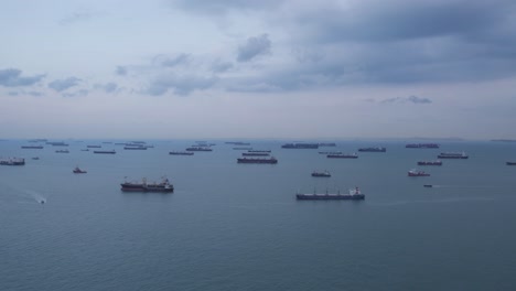 view of many logistic transport freight container ships in the sea