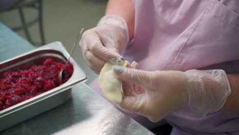 woman making pierogi