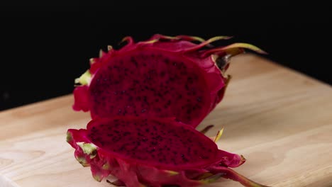 dragon fruit being sliced and displayed