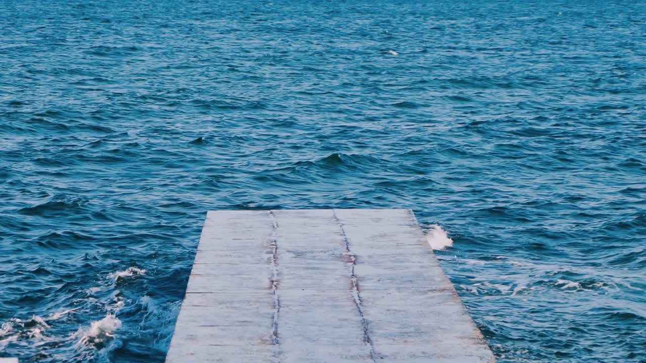 Beautiful seascape view. Perspective view of stone pier on the sea