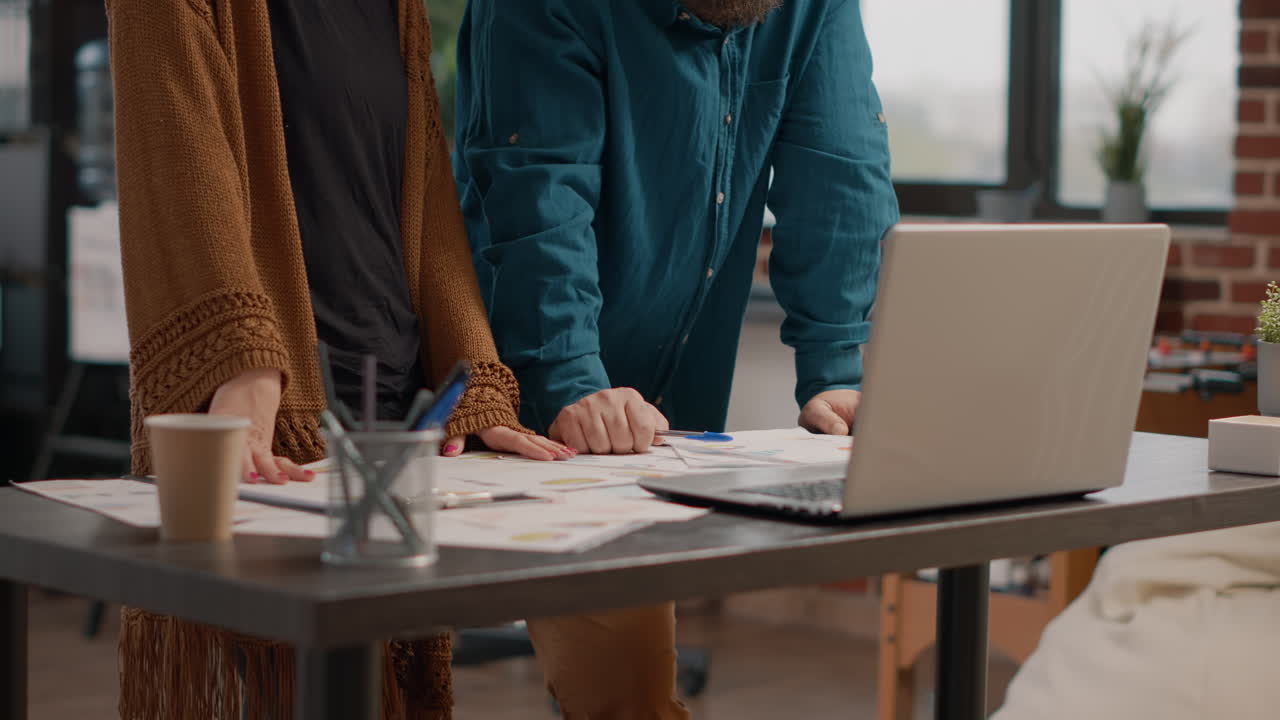 Business Team Discussing Work at Desk