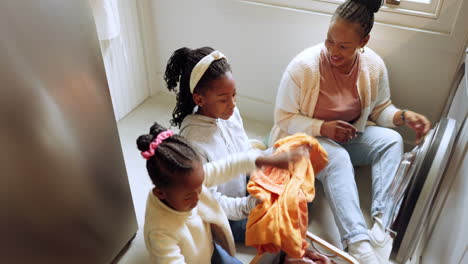 Laundry,-children-helping-mother-in-home