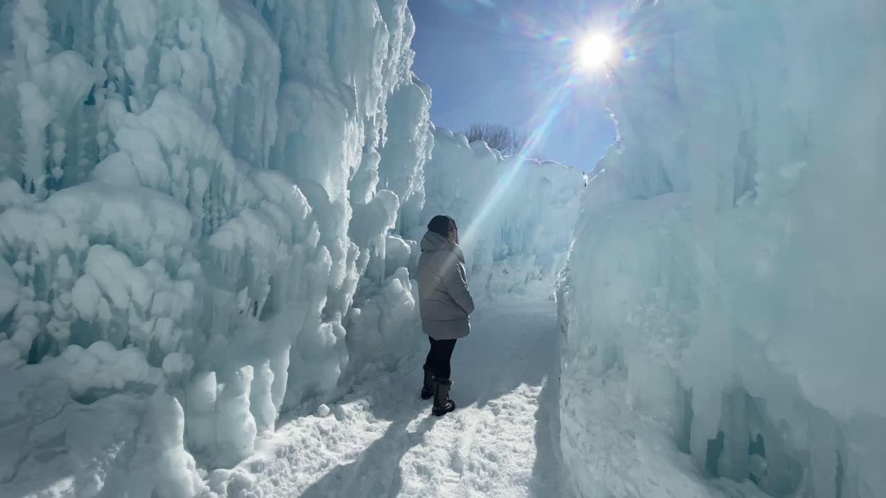 Woman exploring the ice castles, winterwonderland