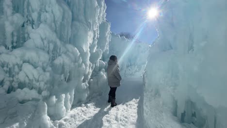 woman exploring the ice castles, winterwonderland