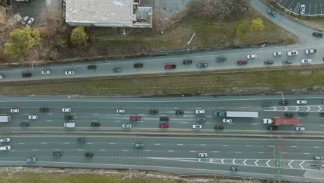 slow static zoom out aerial of highway traffic