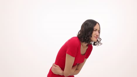 young woman suffering from severe stomach pain