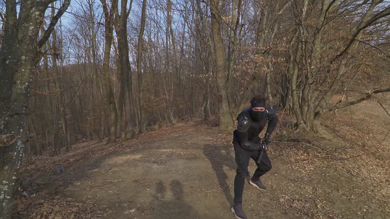 A masked ninja skillfully slices through an airborne object with his katana, displaying precision and power. Perfect for martial arts, cinematic action, and warrior-themed visuals.